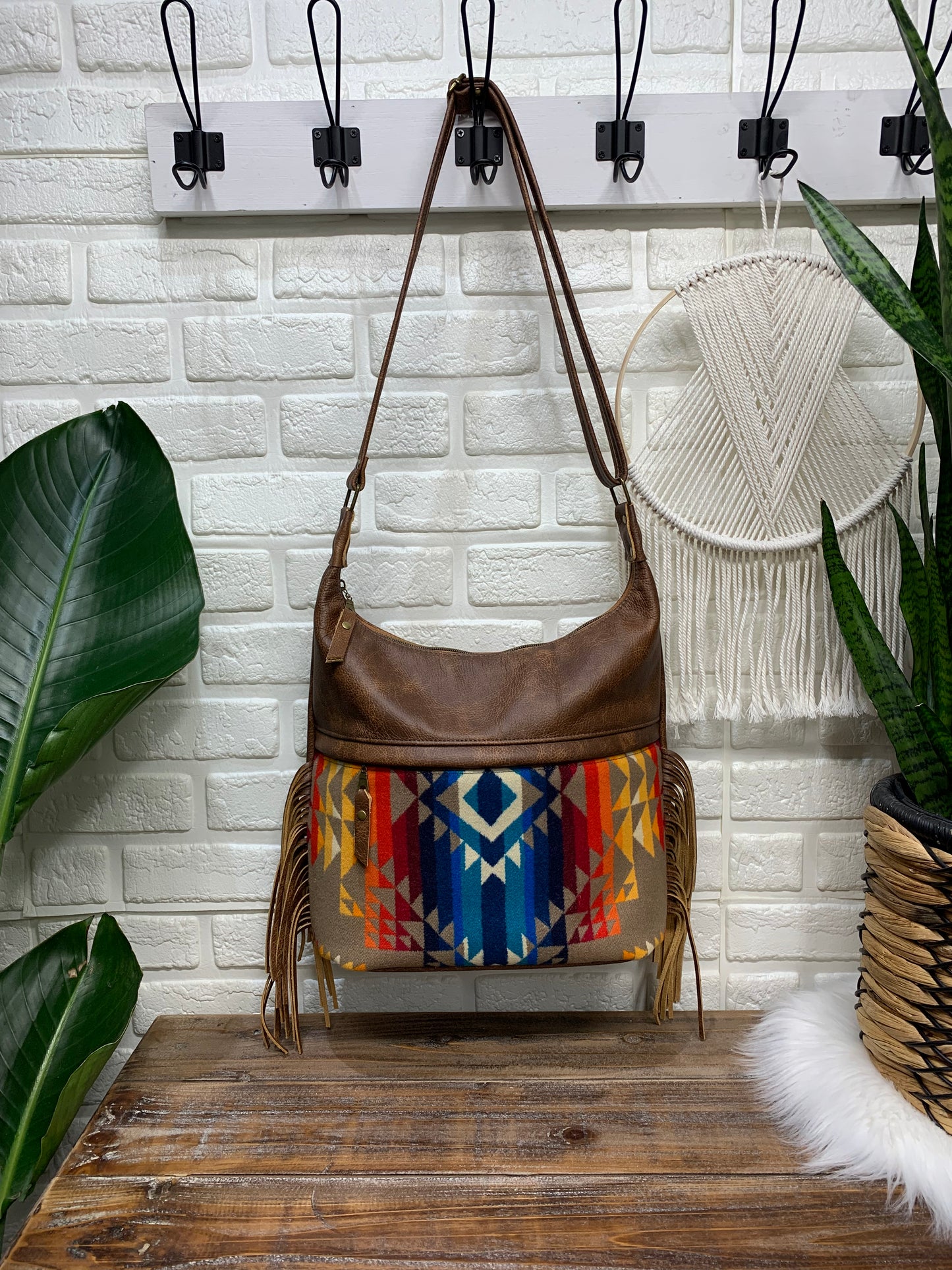 Bucket hobo bag crossbody in Pilot Rock wool and saddle brown leather with Fringe