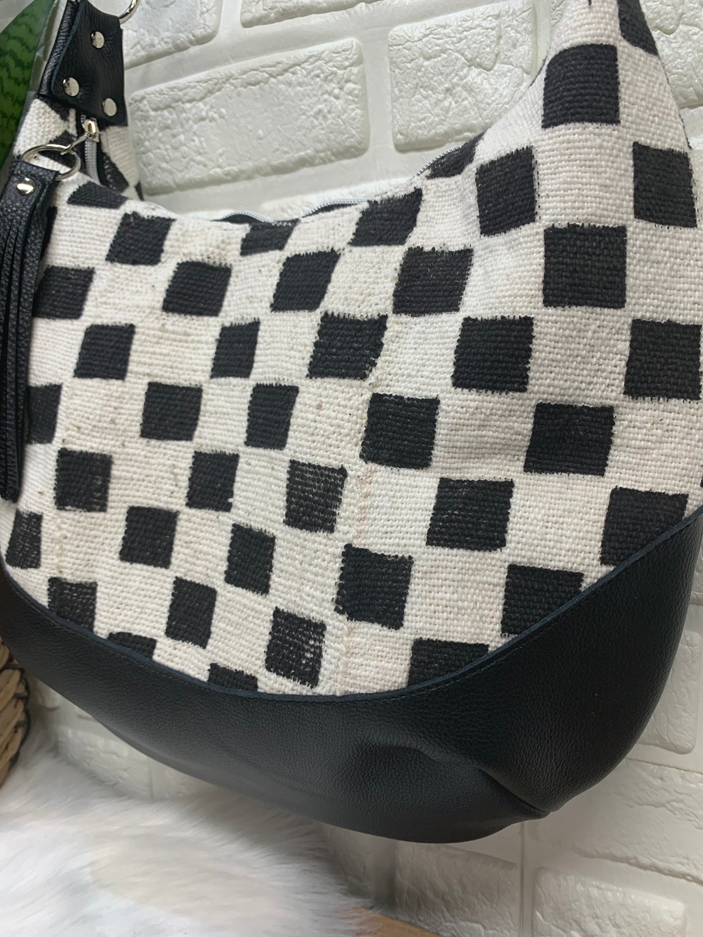 Checkered Mud Cloth and black leather hobo crossbody bag